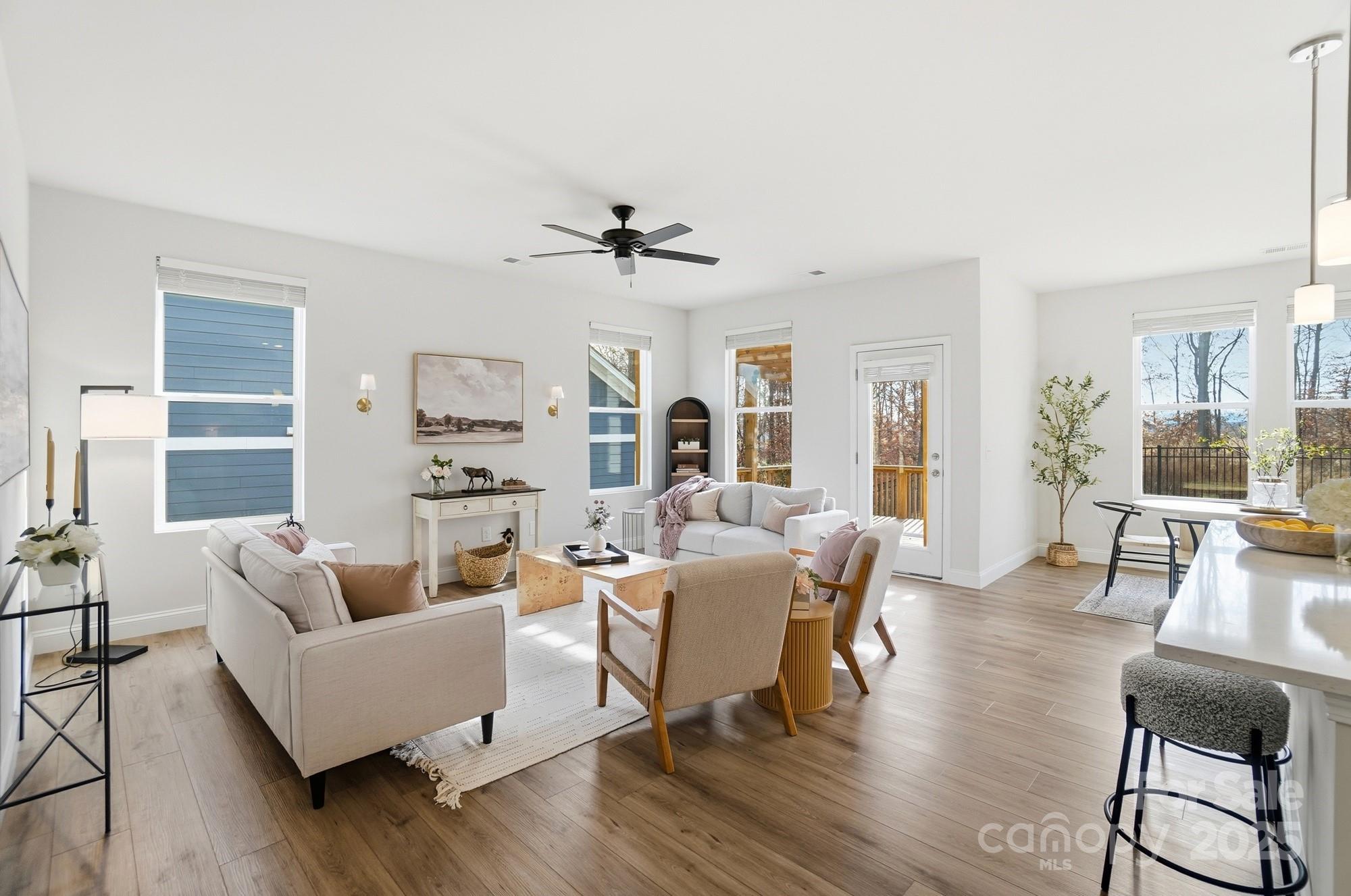 256 Hamrick Road, Unit 12 Cramerton, NC 28056 - Photo 18 of 41 a living room with furniture dining table and a large window