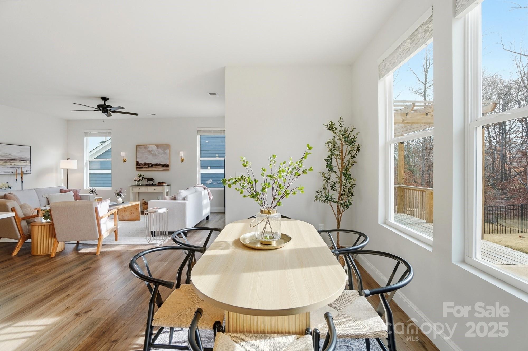 256 Hamrick Road, Unit 12 Cramerton, NC 28056 - Photo 20 of 41 a view of a dining room with furniture window and wooden floor