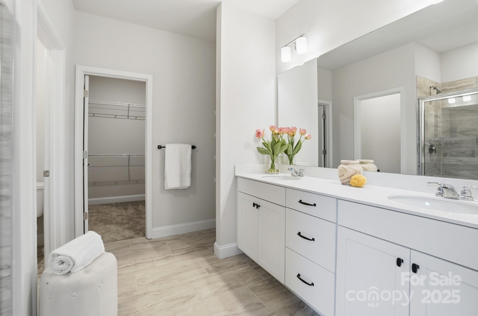 256 Hamrick Road, Unit 12 Cramerton, NC 28056 - Photo 27 of 41 a spacious bathroom with a granite countertop sink mirror and shower
