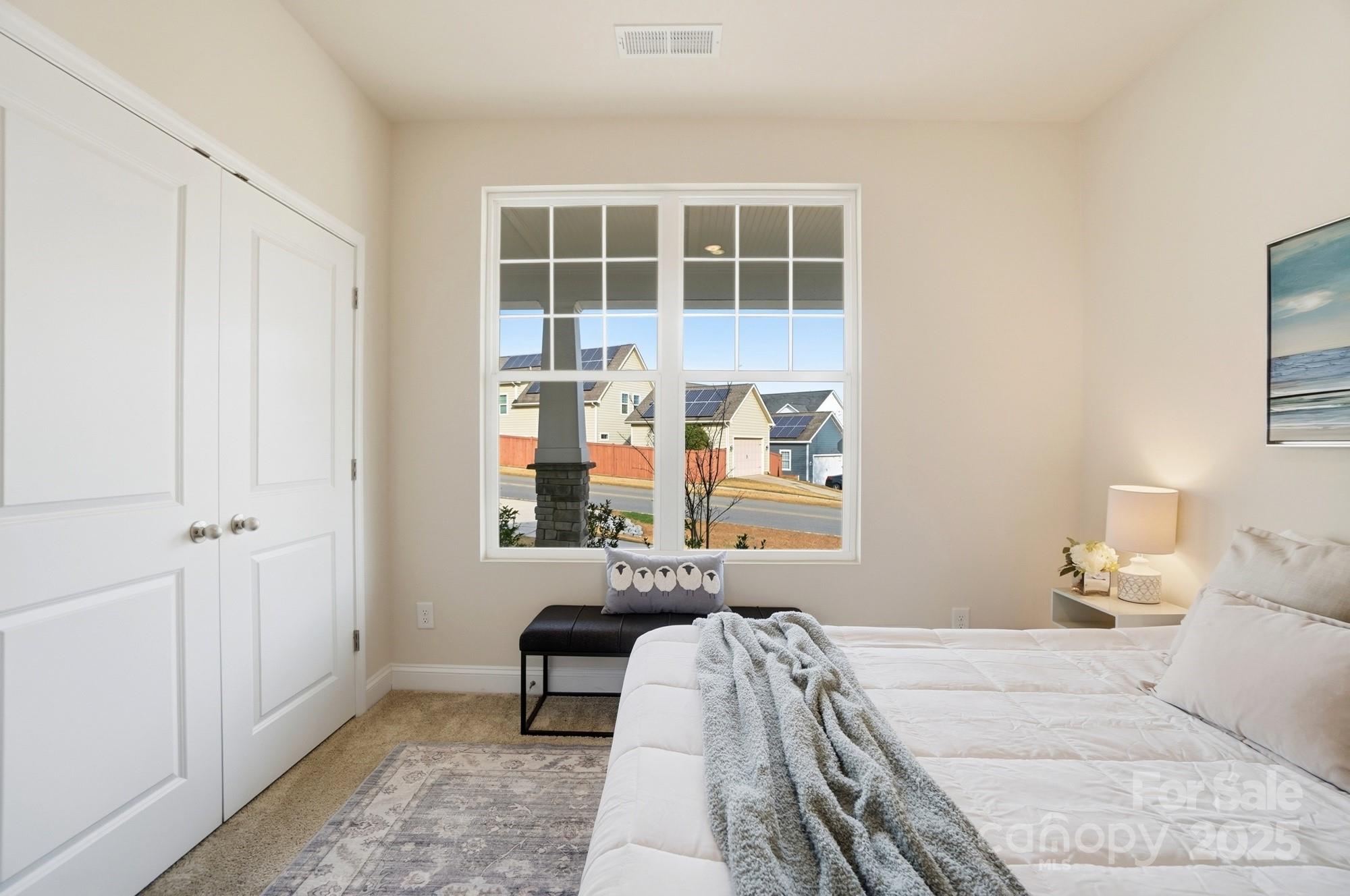 256 Hamrick Road, Unit 12 Cramerton, NC 28056 - Photo 34 of 41 a bedroom with a bed and a window