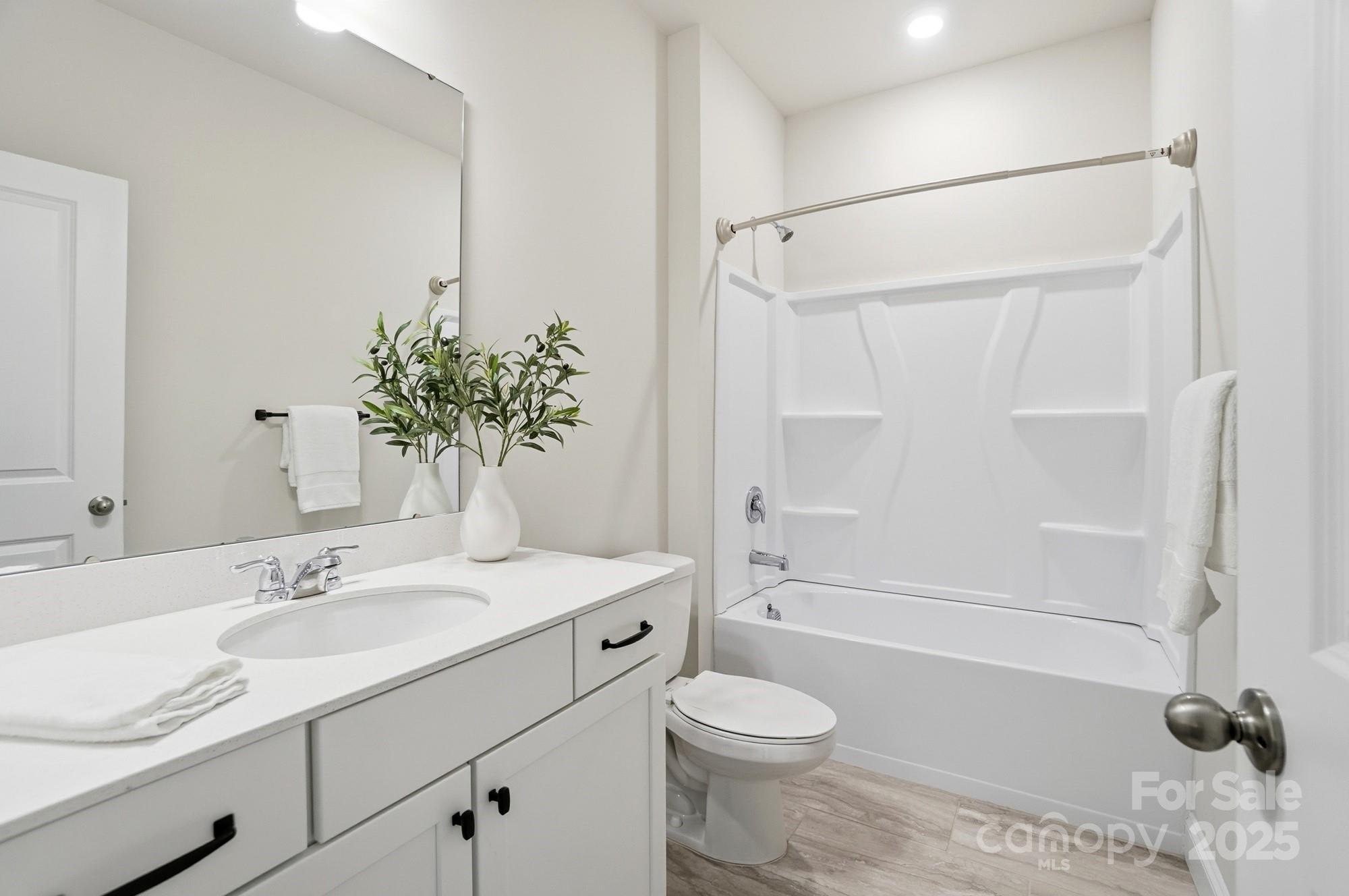 256 Hamrick Road, Unit 12 Cramerton, NC 28056 - Photo 35 of 41 a bathroom with a sink toilet and shower