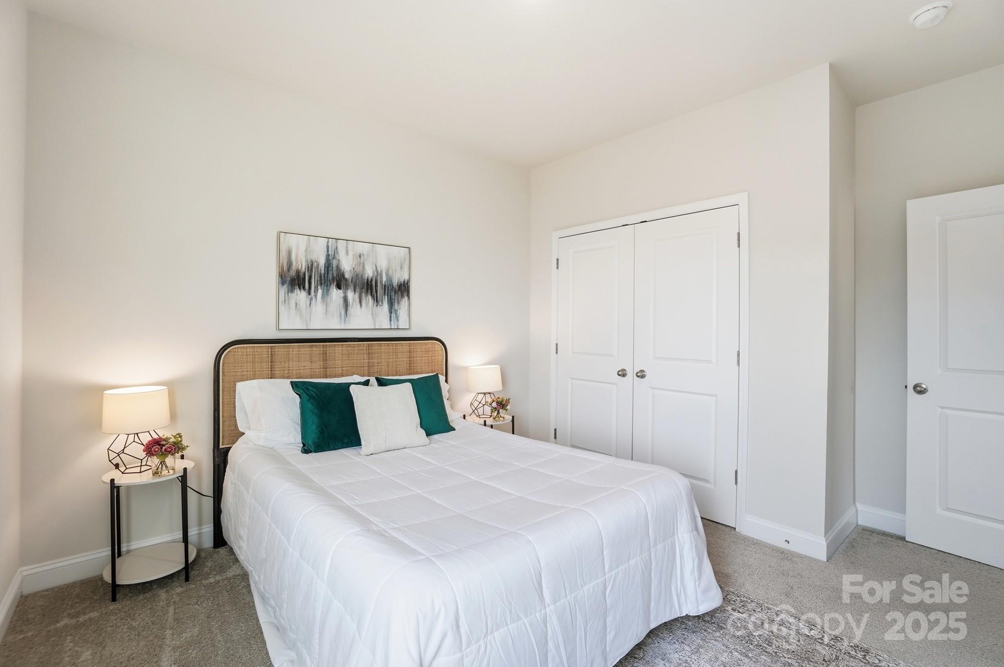 256 Hamrick Road, Unit 12 Cramerton, NC 28056 - Photo 36 of 41 a bedroom with a bed and a night stand