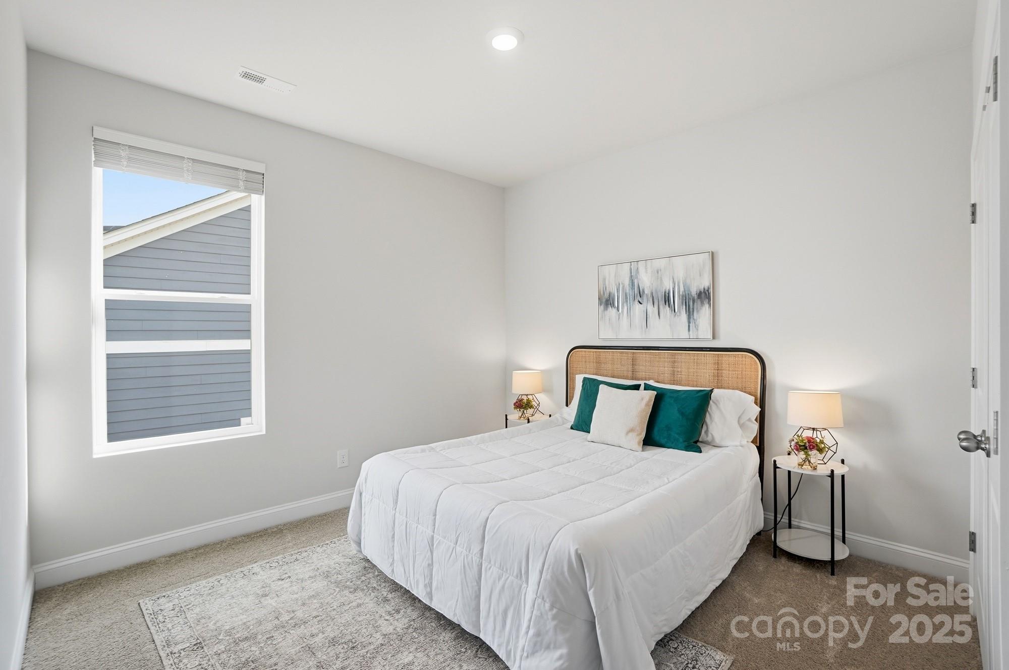 256 Hamrick Road, Unit 12 Cramerton, NC 28056 - Photo 37 of 41 a bedroom with a large bed and a window