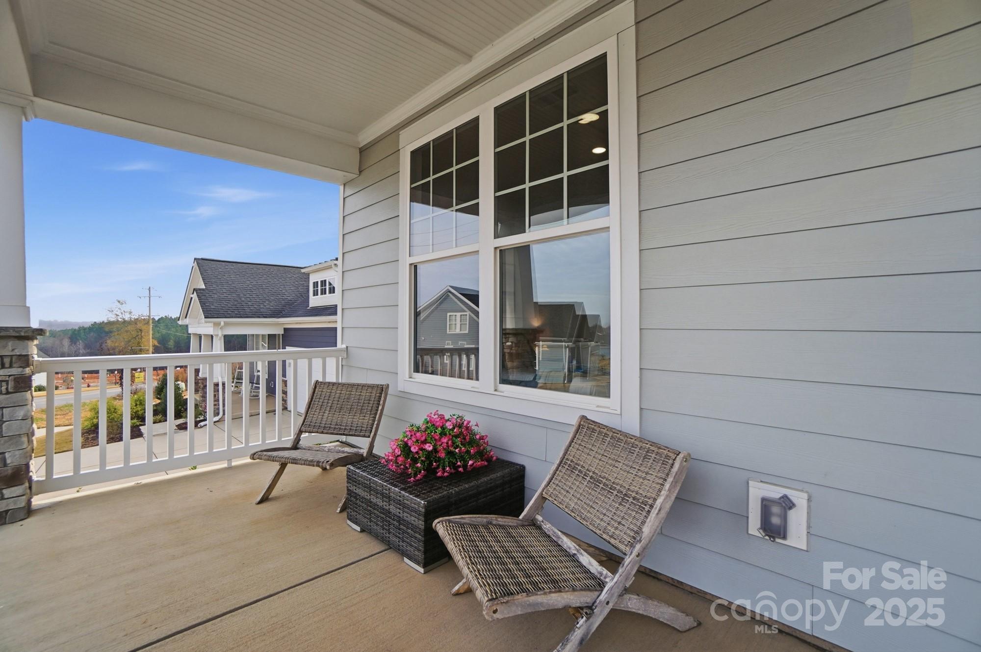 256 Hamrick Road, Unit 12 Cramerton, NC 28056 - Photo 5 of 41 a balcony with furniture and a potted plant