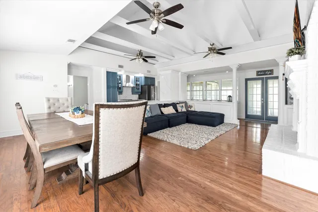 a view of a dining room with furniture and wooden floor