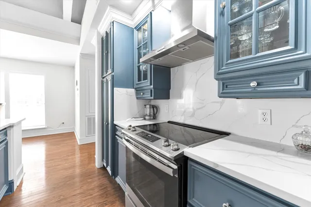 a kitchen with a stove and a sink