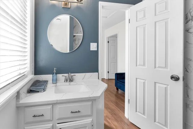 a bathroom with a sink and a mirror