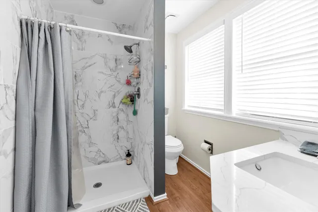 a bathroom with a bathtub and a shower