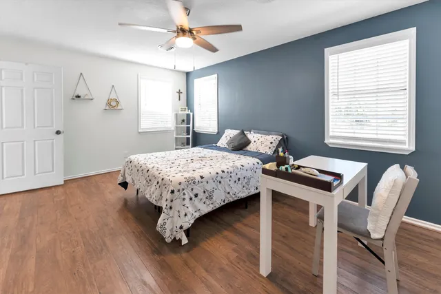 a bedroom with a bed and a table in it