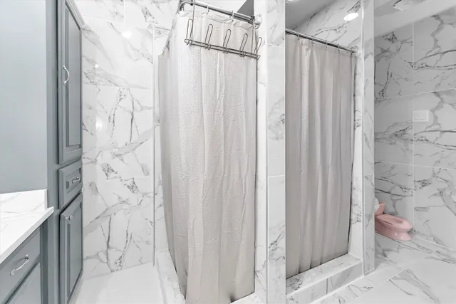 a bathroom with a shower curtain