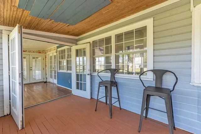 a view of a livingroom with furniture and wooden floor