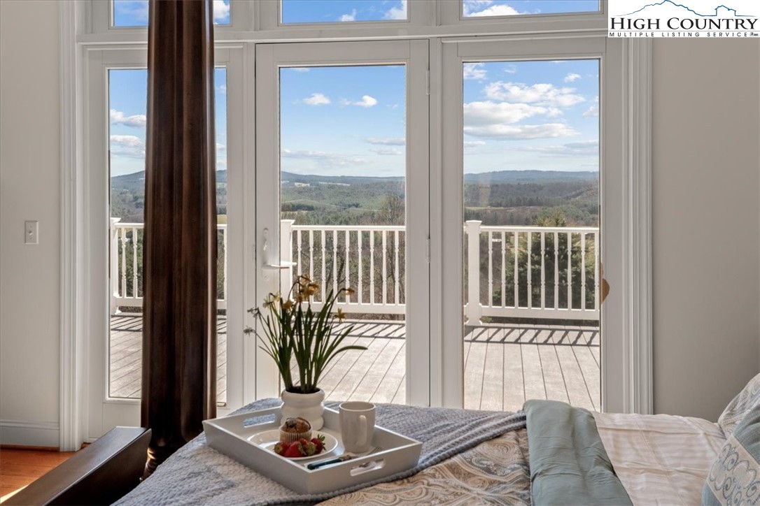 368 Fox Run Lane Sparta, NC 28675 - Photo 14 of 50 a vase of flowers sitting next to a window
