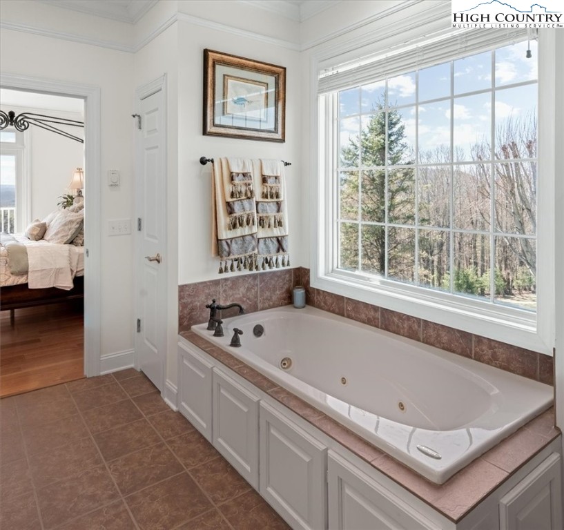 368 Fox Run Lane Sparta, NC 28675 - Photo 17 of 50 a bath tub sitting next to a window