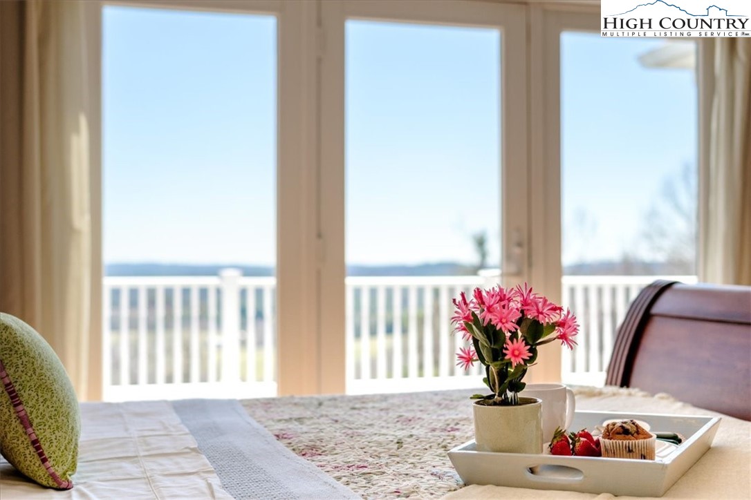 368 Fox Run Lane Sparta, NC 28675 - Photo 18 of 50 a view of a dining room with a potted plant