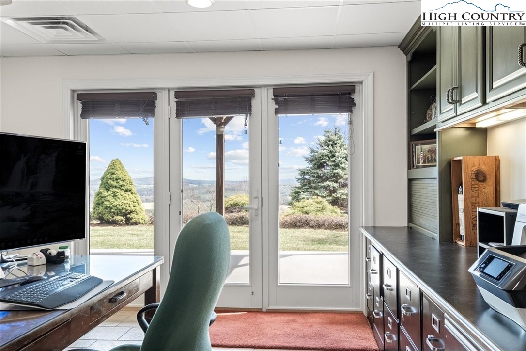 368 Fox Run Lane Sparta, NC 28675 - Photo 26 of 50 a work room with furniture and a flat screen tv
