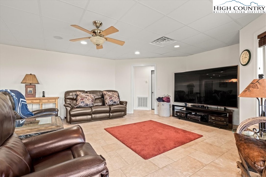 368 Fox Run Lane Sparta, NC 28675 - Photo 35 of 50 a living room with furniture and a flat screen tv