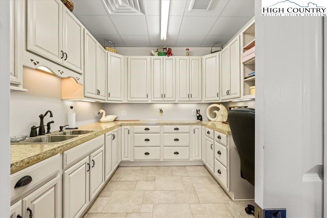 368 Fox Run Lane Sparta, NC 28675 - Photo 38 of 50 a kitchen with granite countertop white cabinets and stainless steel appliances