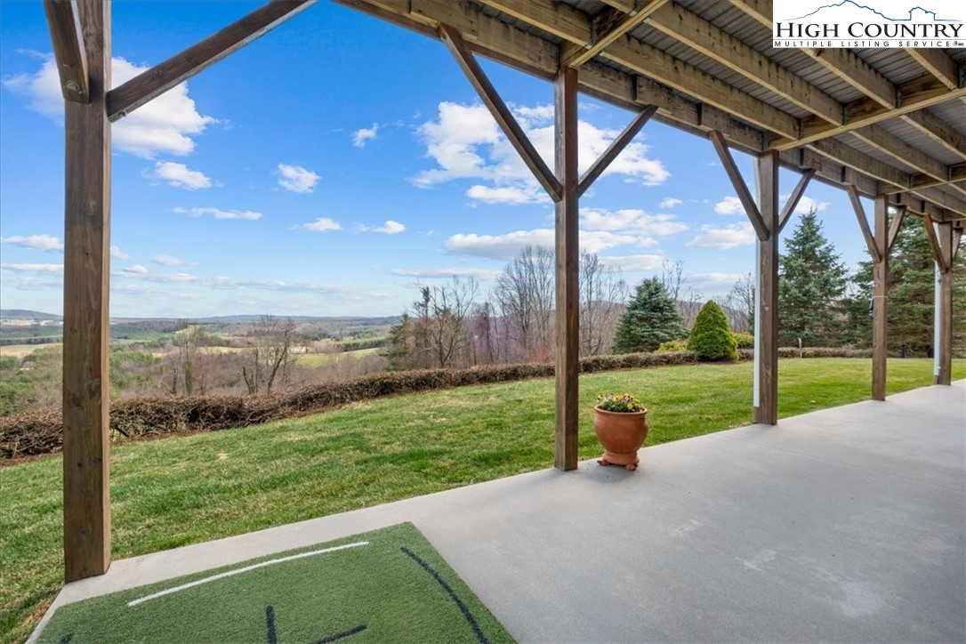 368 Fox Run Lane Sparta, NC 28675 - Photo 40 of 50 a view of a yard with porch and wooden fence