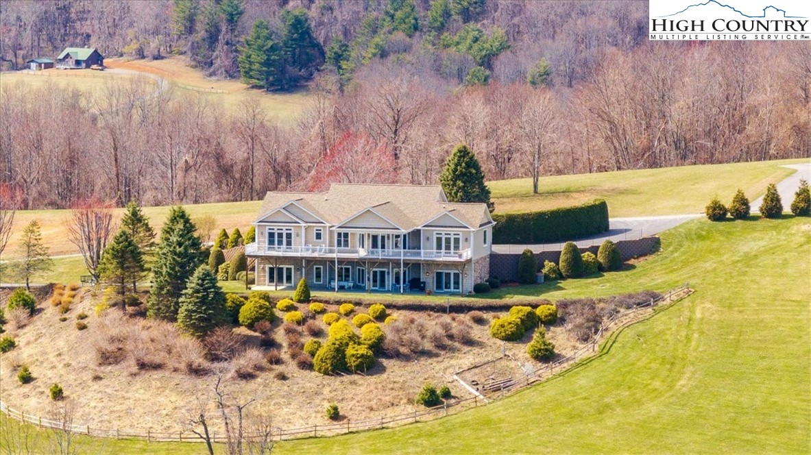368 Fox Run Lane Sparta, NC 28675 - Photo 43 of 50 a view of a house with swimming pool and sitting area