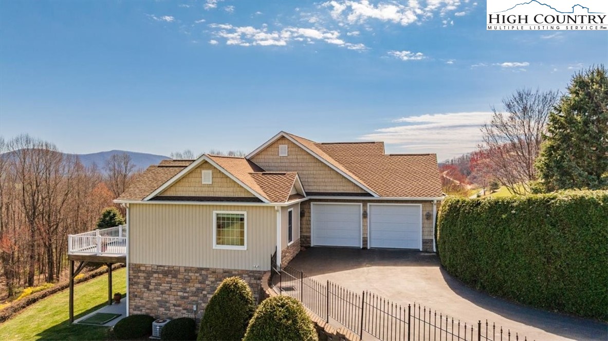 368 Fox Run Lane Sparta, NC 28675 - Photo 46 of 50 a view of a house with backyard and garden