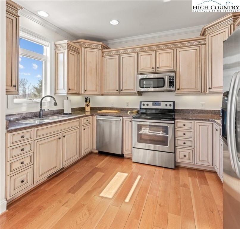 368 Fox Run Lane Sparta, NC 28675 - Photo 5 of 50 a kitchen with stainless steel appliances granite countertop a sink a stove a refrigerator with grey cabinets