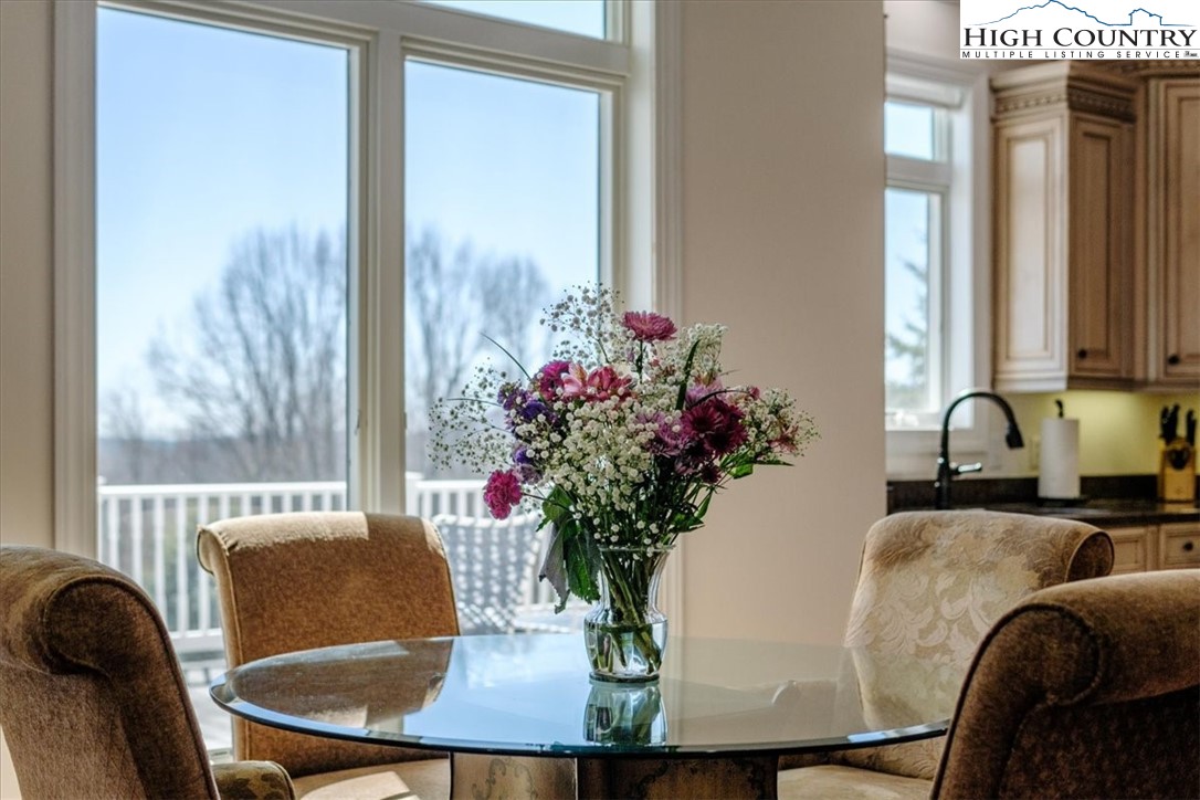 368 Fox Run Lane Sparta, NC 28675 - Photo 7 of 50 a view of a dining room with furniture window and wooden floor
