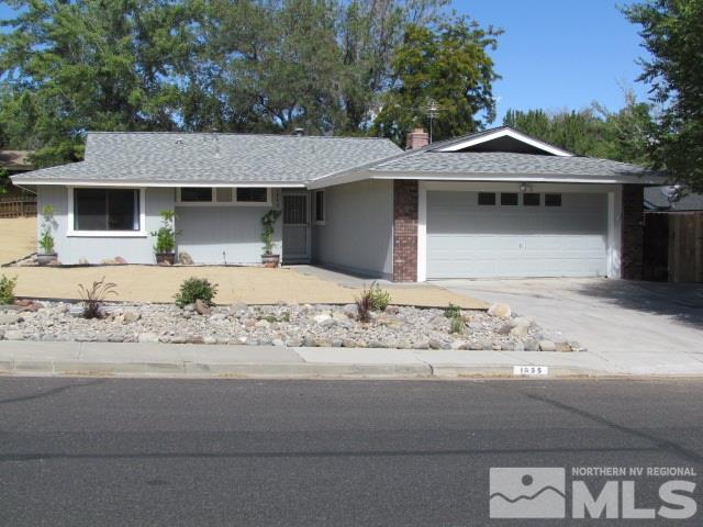 1855 Prior Reno, NV 89503 - Photo 1 of 25 a front view of a house with a yard