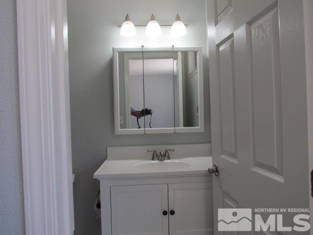 1855 Prior Reno, NV 89503 - Photo 13 of 25 a bathroom with a sink and a mirror