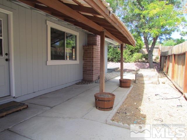 1855 Prior Reno, NV 89503 - Photo 25 of 25 a view of a backyard with table and chairs and wooden fence