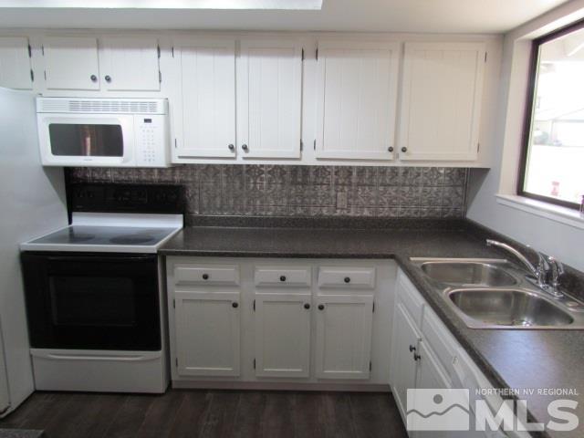 1855 Prior Reno, NV 89503 - Photo 6 of 25 a kitchen with granite countertop white cabinets and sink