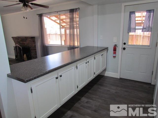 1855 Prior Reno, NV 89503 - Photo 7 of 25 a kitchen with granite countertop a sink a window and stainless steel appliances