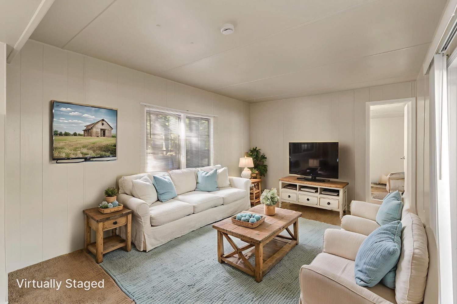 3950 Highway 4, Unit 27 Avery, CA 95224 - Photo 9 of 18 Please note that the image shown is a virtually staged representation of the room and is intended to provide a visual concept of the space. The actual room may differ in appearance, and the furniture and decor depicted are not included in the sale. For an accurate understanding of the property's current condition and layout, we encourage you to view the home in person. Thank you