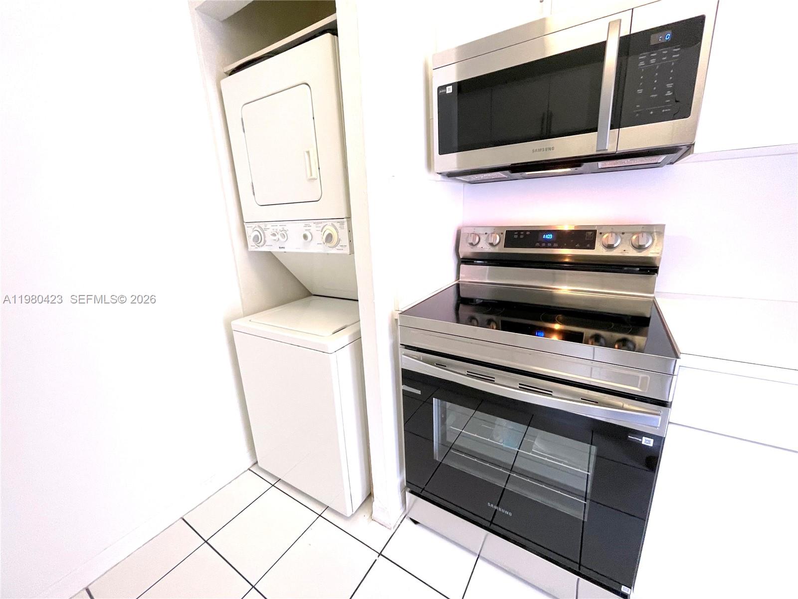 2138 Southwest 6th Street, Unit 201 Miami, FL 33135 - Photo 15 of 18 a kitchen with a stove and a microwave