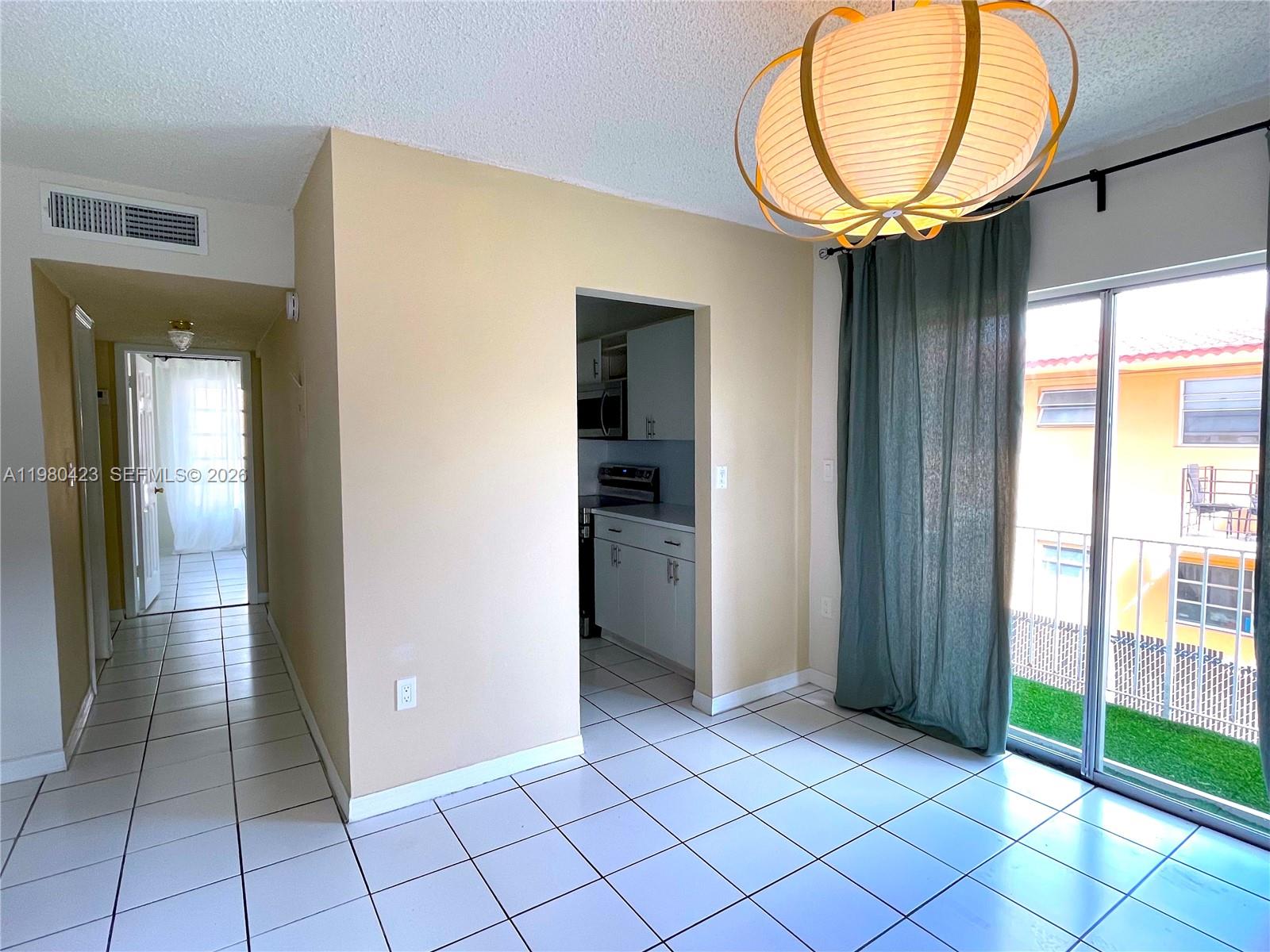 2138 Southwest 6th Street, Unit 201 Miami, FL 33135 - Photo 17 of 18 an empty room with mirror and windows
