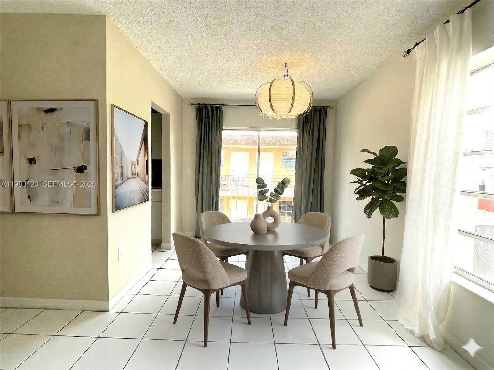 2138 Southwest 6th Street, Unit 201 Miami, FL 33135 - Photo 2 of 18 a view of a dining room with furniture window and wooden floor
