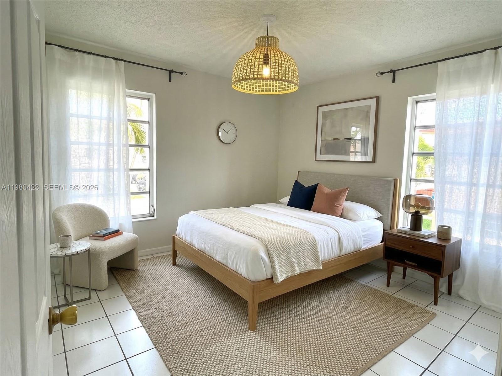 2138 Southwest 6th Street, Unit 201 Miami, FL 33135 - Photo 4 of 18 a bedroom with a bed chair and a window