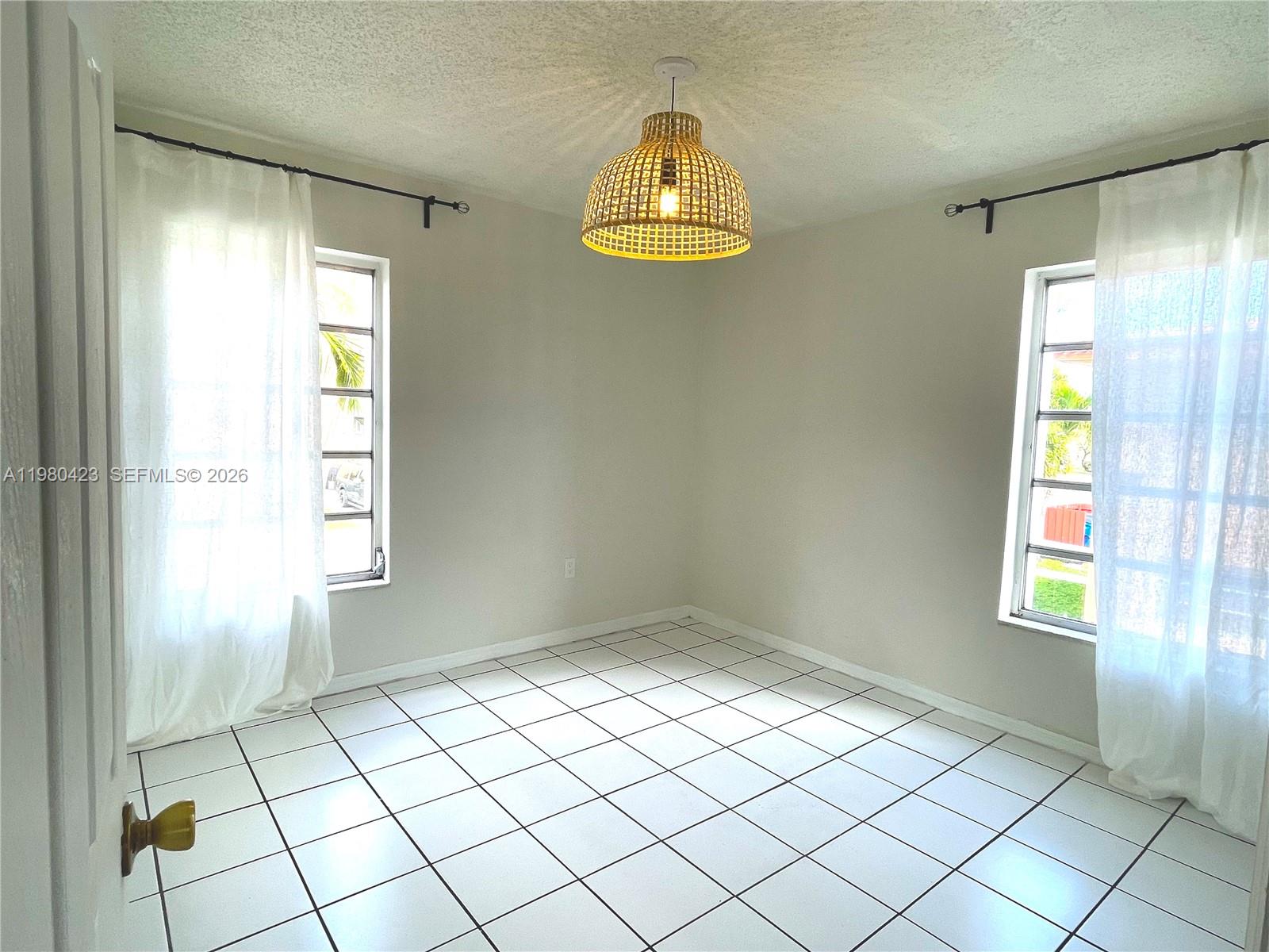 2138 Southwest 6th Street, Unit 201 Miami, FL 33135 - Photo 6 of 18 a view of an empty room and window