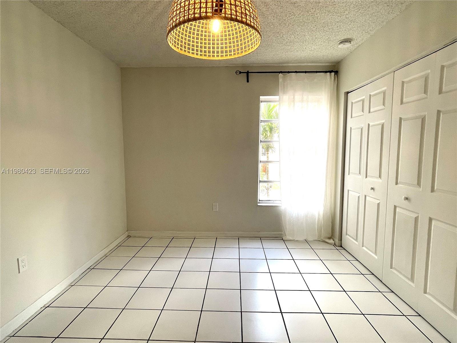 2138 Southwest 6th Street, Unit 201 Miami, FL 33135 - Photo 7 of 18 a view of an empty room and window