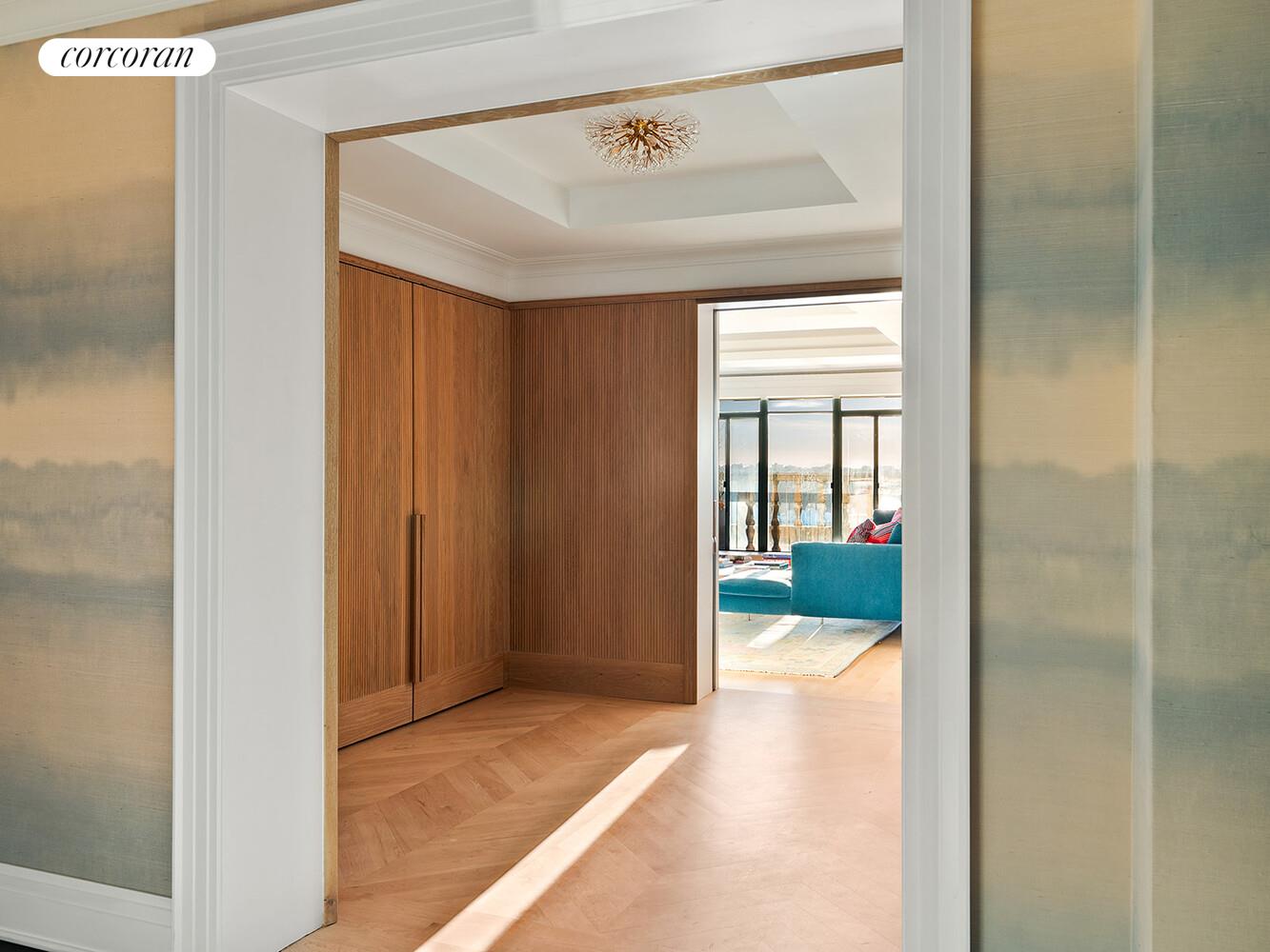 140 Riverside Drive, Unit 19HO Manhattan, NY 10024 - Photo 6 of 35 a view of a hallway with wooden floor and a bathroom