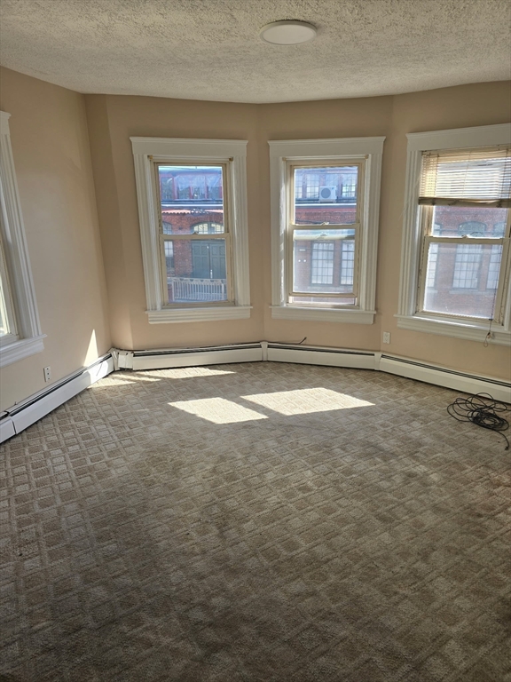 159 Warren Avenue, Unit 2 Pawtucket, RI 02860 - Photo 4 of 10 a view of an empty room with a window