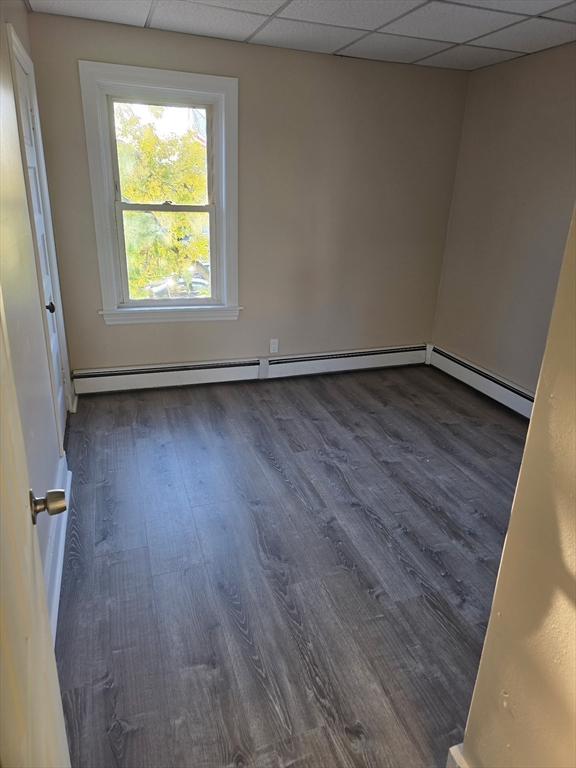 159 Warren Avenue, Unit 2 Pawtucket, RI 02860 - Photo 9 of 10 a view of an empty room with wooden floor and a window