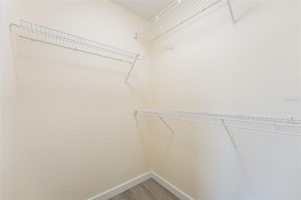 5447 Vineland Road, Unit 1308 Orlando, FL 32811 - Photo 17 of 31 a view of a room with racks on the wall