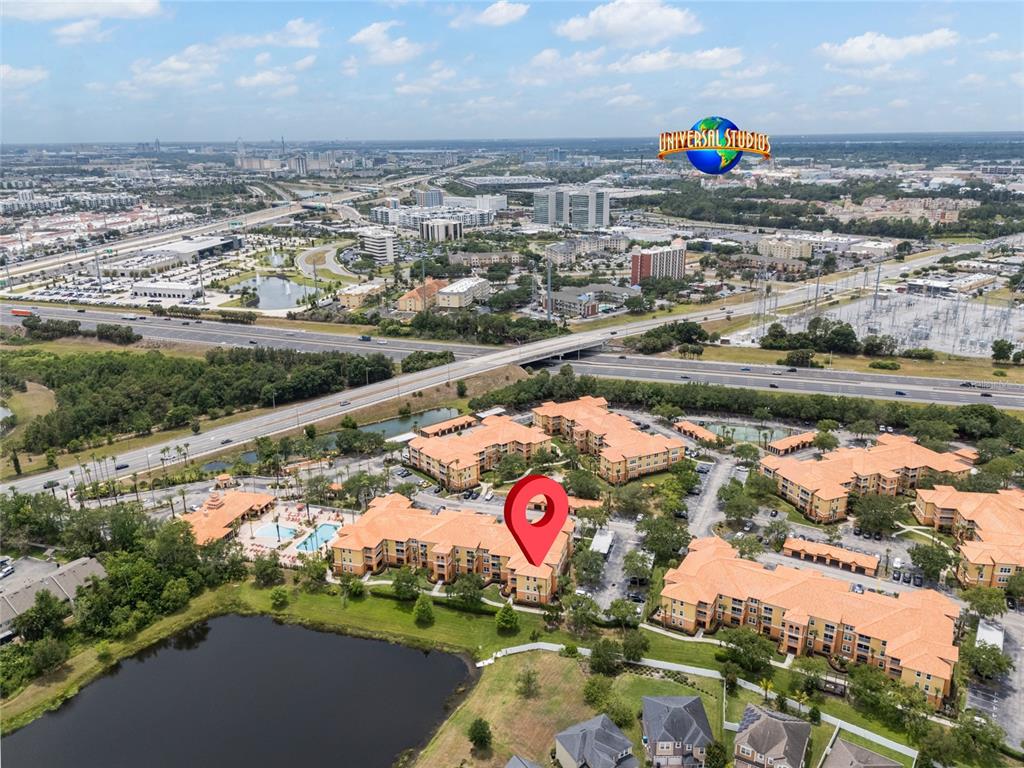 5447 Vineland Road, Unit 1308 Orlando, FL 32811 - Photo 2 of 31 an aerial view of residential houses with outdoor space