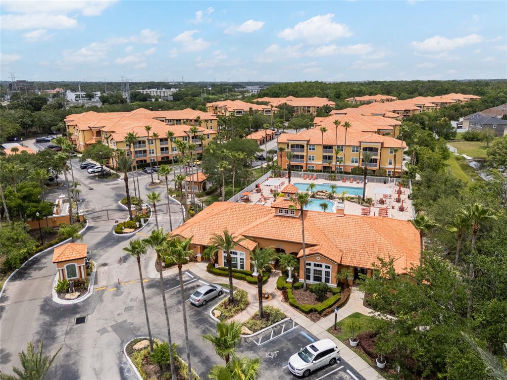 5447 Vineland Road, Unit 1308 Orlando, FL 32811 - Photo 26 of 31 an aerial view of residential houses and outdoor space