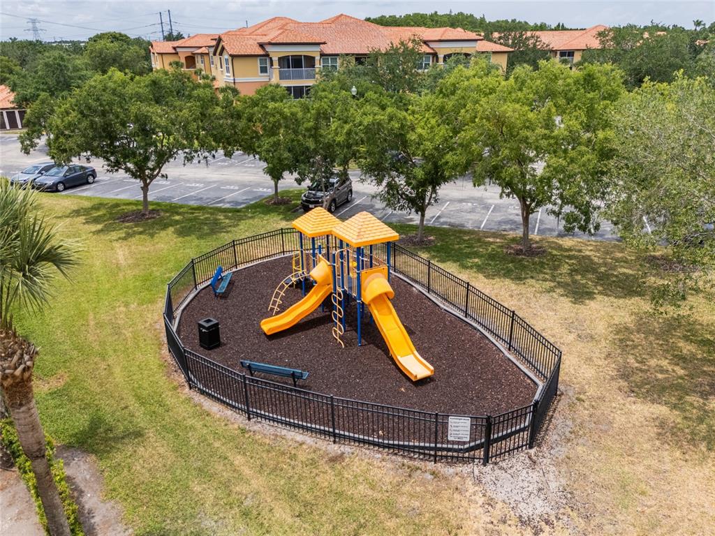 5447 Vineland Road, Unit 1308 Orlando, FL 32811 - Photo 28 of 31 a view of a swimming pool with a yard