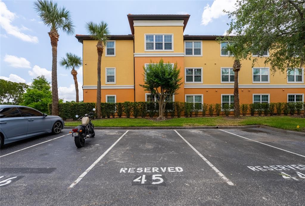 5447 Vineland Road, Unit 1308 Orlando, FL 32811 - Photo 30 of 31 a cars parked in front of a house