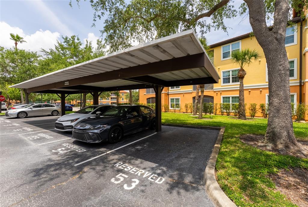 5447 Vineland Road, Unit 1308 Orlando, FL 32811 - Photo 31 of 31 a view of a car parked in front of a house