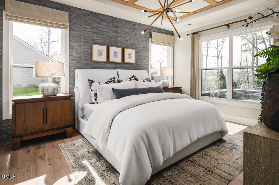 2424 Fleming Stone Lane, Unit 46 Raleigh, NC 27610 - Photo 10 of 27 a bedroom with a large bed and a window