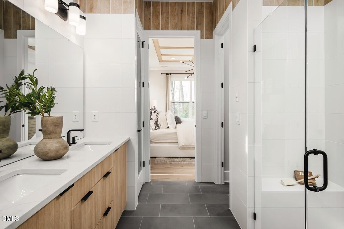 2424 Fleming Stone Lane, Unit 46 Raleigh, NC 27610 - Photo 11 of 27 a bathroom with a sink a potted plant and a mirror