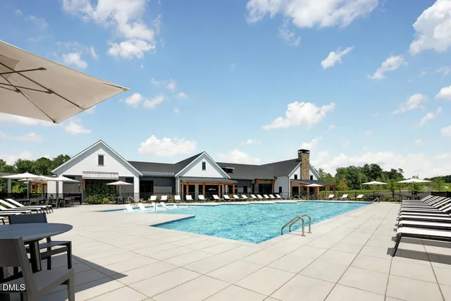 a view of a tennis court with sitting area